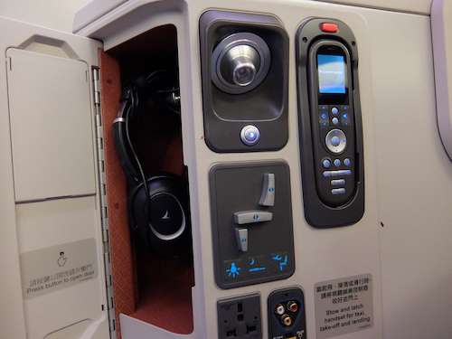 Seat and entertainment controls and a handy storage headphone compartment.