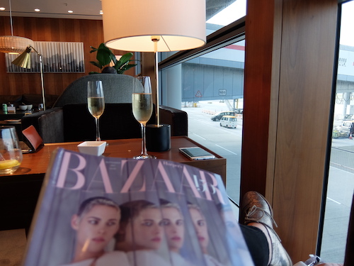 Taking in the view over the tarmac from Cathay Pacific's The Pier Lounge bar.