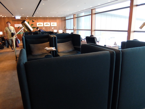 Work spaces and high backed lounge chairs provide private seating options.