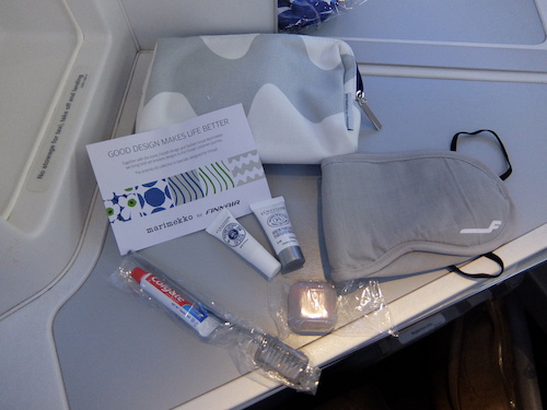 Finnair amenity kit included skin products along with eye mask, ear plugs, and tooth brush kit.