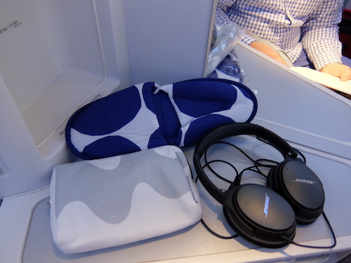 Onboard gifts include an Amenity kit and slippers.