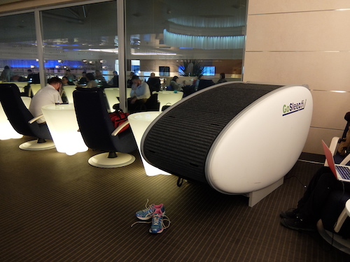Sleep pod and recliners on the Finnair business class lounge mezzanine.