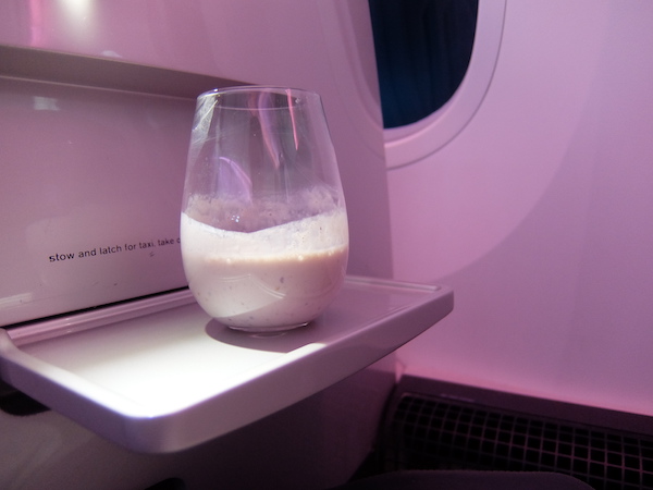 Mixed berry, coconut yoghurt and chia seed smoothie onboard Air New Zealand business class.