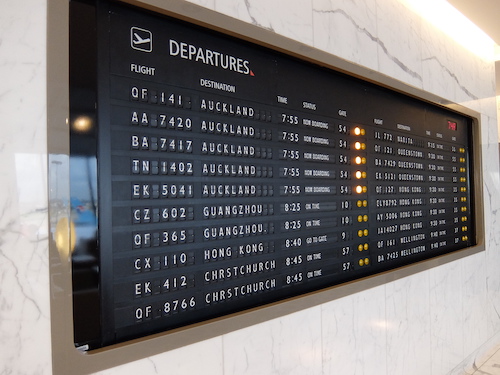 Qantas First Class lounge departures board.