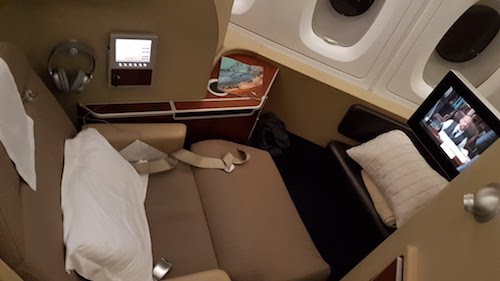 The seat swivels to face the ottoman and screen.