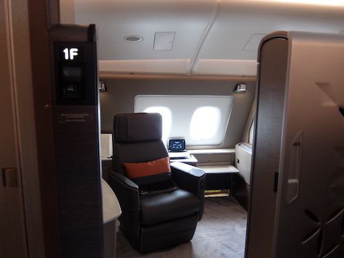 Singapore Airlines Suite with the door open.
