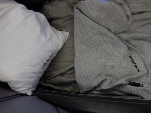 Saks Fifth Avenue bedding includes a soft mattress topper.