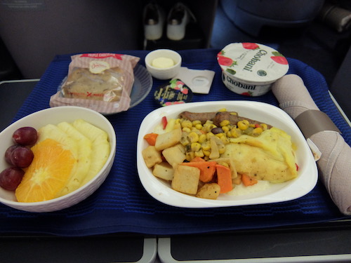 United Airline Business Class inflight meals: Omelette with a side of fruit and yoghurt.
