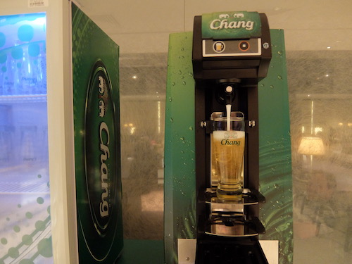 A Chang beer machine professionally pours your beer for you.