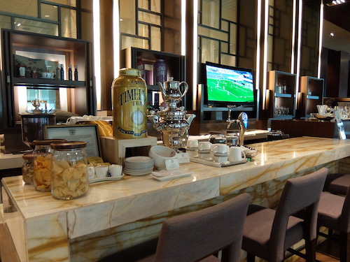 Fully stocked First Class bar, staffed with a bartender.