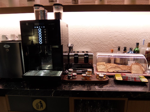 Breakfast food and coffee available in the dining room.