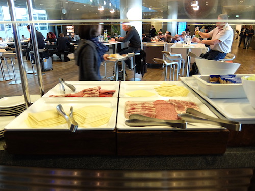 European style breakfast with cold meats and cheeses in the Lufthansa lounge buffet.