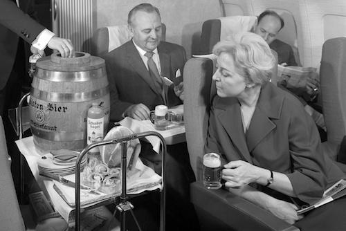 Business Class passengers enjoying the Oktoberfest keg in the 1960s
