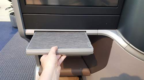 Singapore Airlines A350 Dining table slides out from underneath the entertainment screen