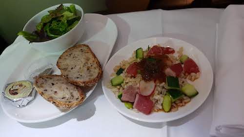 Salad of seared tuna with brown rice, edamame, cucumber, radish and sesame soy dressing.