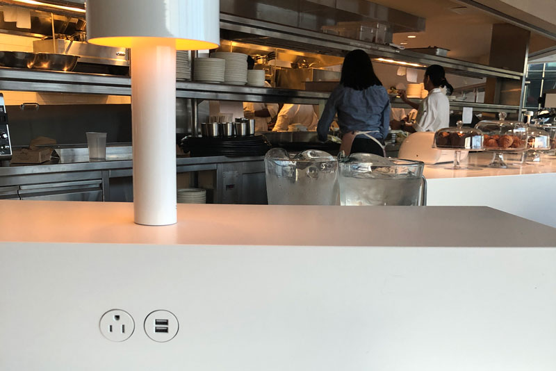 Charging station at the Paris Cafe, with views into the Kitchen