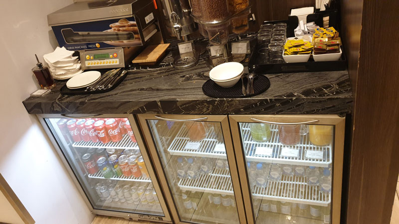 Self-serve fridge with cool drinks and self-serve food options