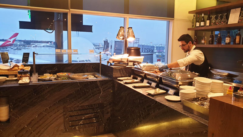 Full-service bar with hot food options