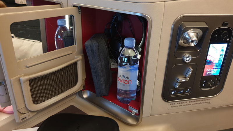 Storage compartment, seat and entertainment controls