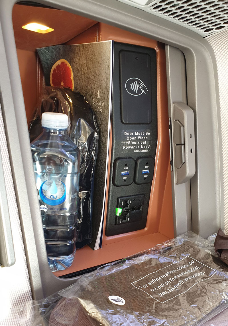 Console storage compartment with AV and USB power outlets