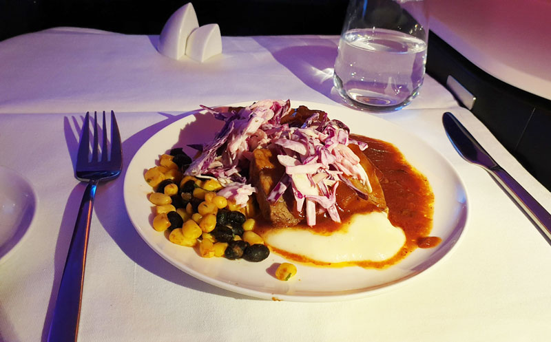 Barbeque spiced beef brisket with potato, coleslaw, corn, and black bean salsa