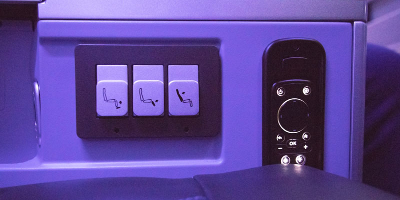 Seat controls and entertainment remote