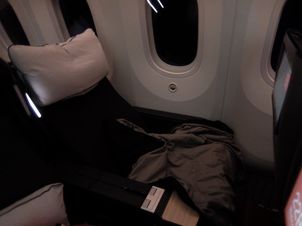 Reclining the Qantas Premium Economy Seat with pillow attached