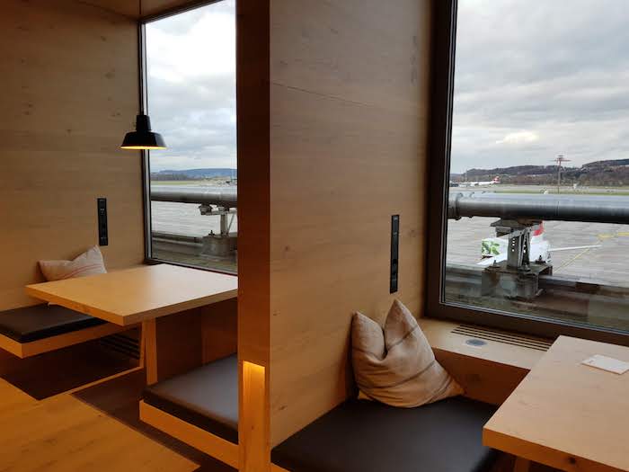 The Lounge features booths with Alpine views.