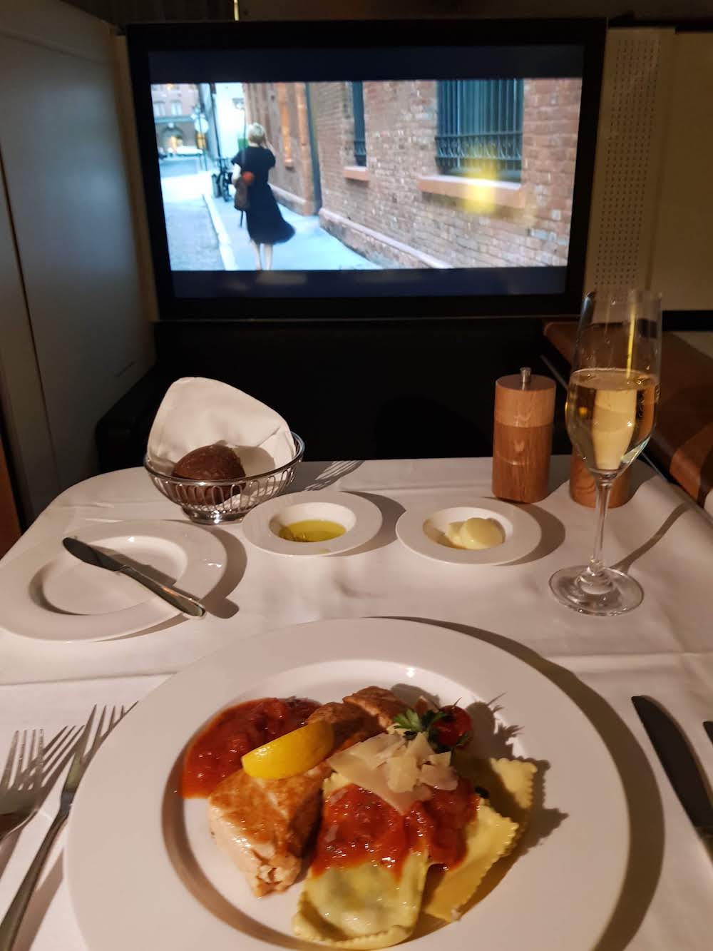 SWISS First Class Inflight Dining - Main Course: Seared salmon with pomodoro sauce.